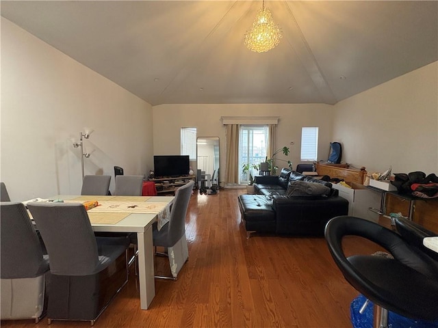 dining space featuring hardwood / wood-style flooring and lofted ceiling