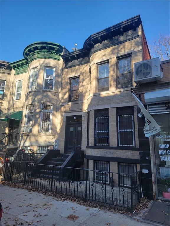 view of front of house featuring ac unit