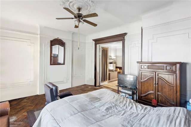 bedroom featuring dark parquet flooring and ceiling fan