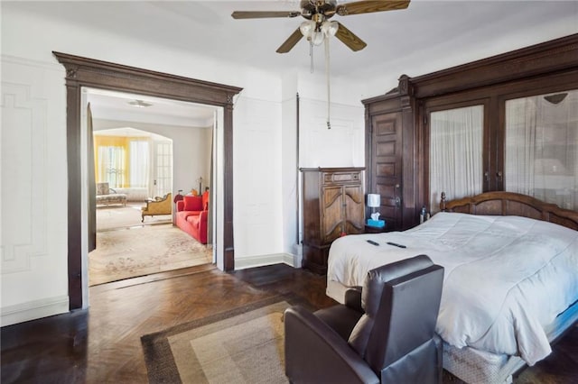 bedroom featuring dark parquet floors and ceiling fan