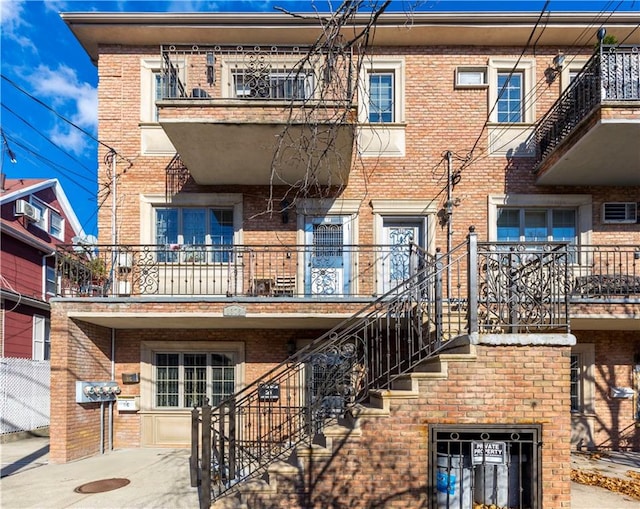 view of property featuring stairs