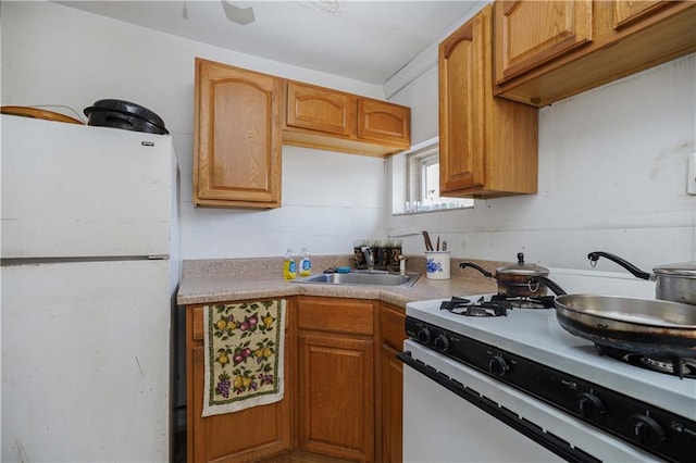 kitchen with white appliances and sink