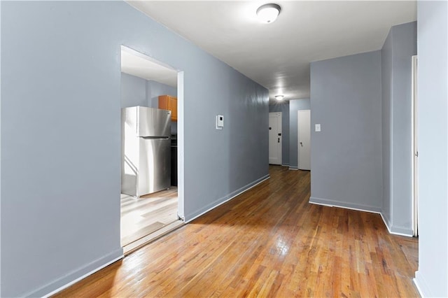 spare room with light wood-type flooring