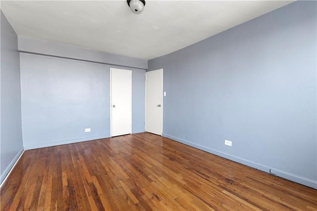 unfurnished bedroom with wood-type flooring