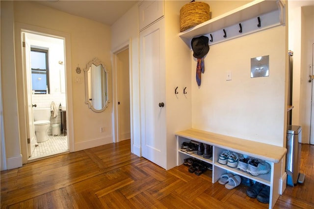 mudroom featuring dark parquet floors