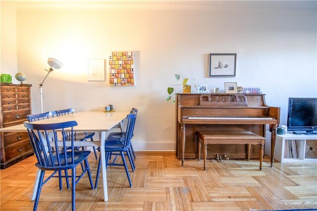 dining area with light parquet floors