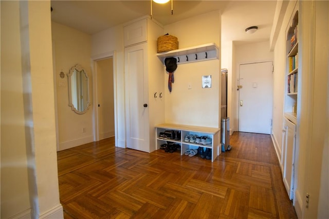 mudroom featuring dark parquet floors