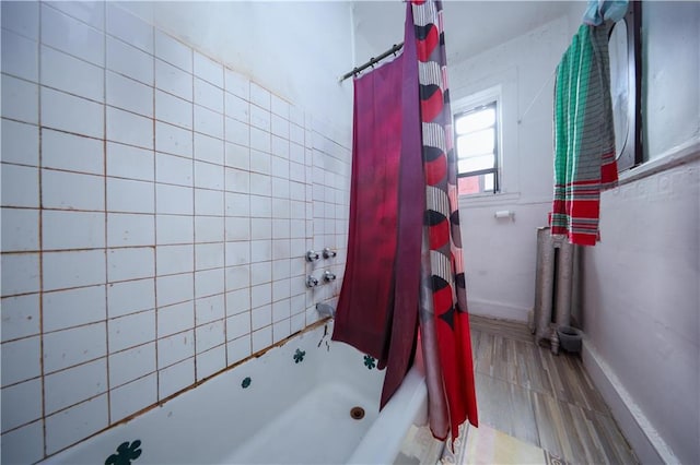 bathroom featuring shower / tub combo with curtain