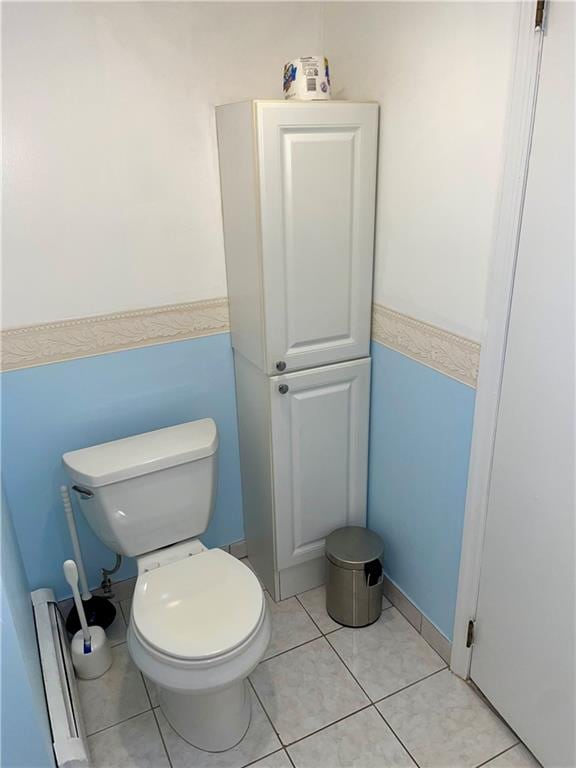 bathroom featuring toilet and tile patterned floors