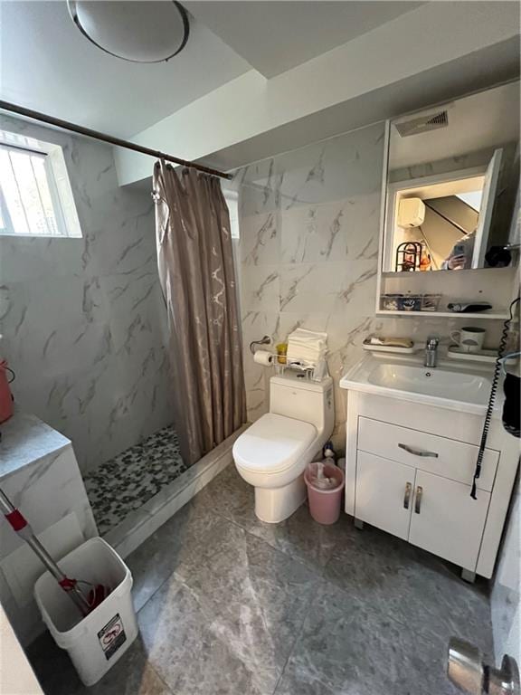 bathroom featuring vanity, toilet, tile walls, and a shower with curtain