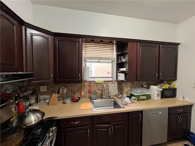 kitchen featuring sink, dark brown cabinets, tasteful backsplash, and stainless steel range oven