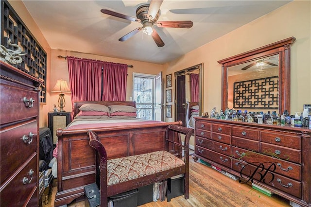 bedroom featuring ceiling fan and light hardwood / wood-style floors