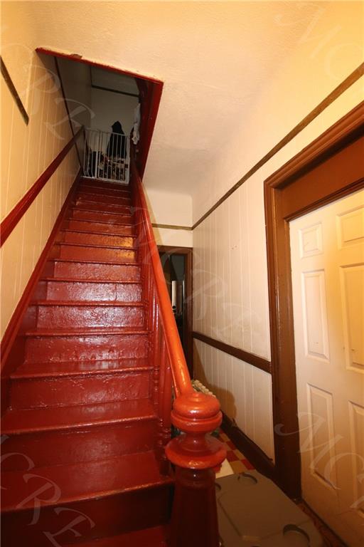 stairs with wainscoting