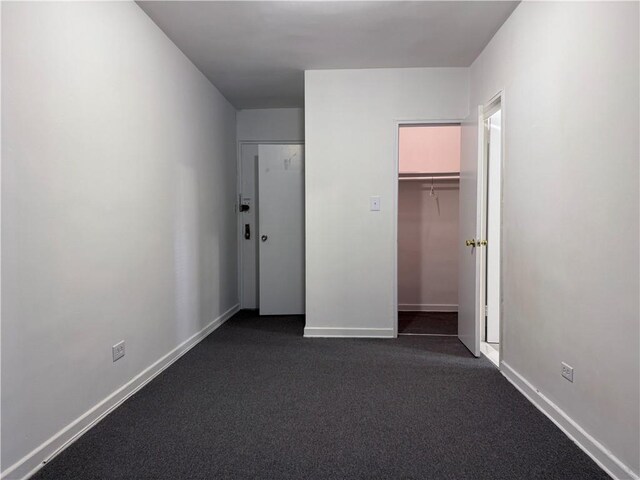 unfurnished bedroom with a closet and a walk in closet