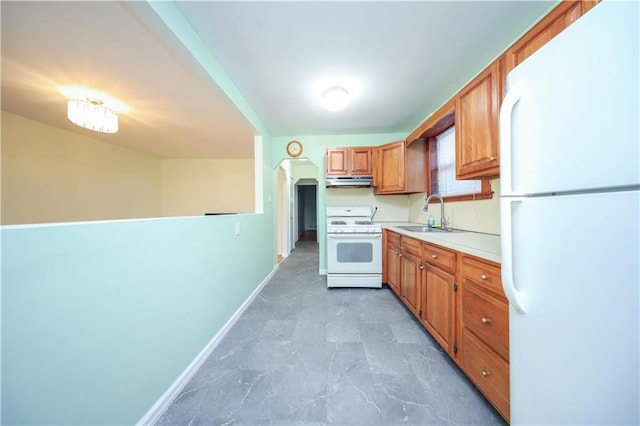 kitchen with white appliances and sink