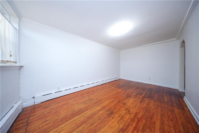 bonus room featuring dark hardwood / wood-style flooring and a baseboard heating unit