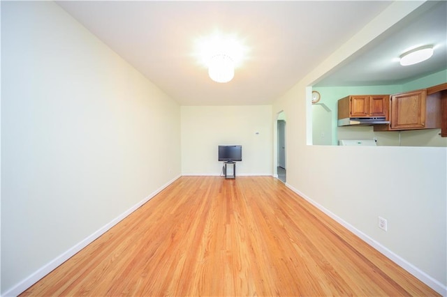 unfurnished living room with light hardwood / wood-style flooring