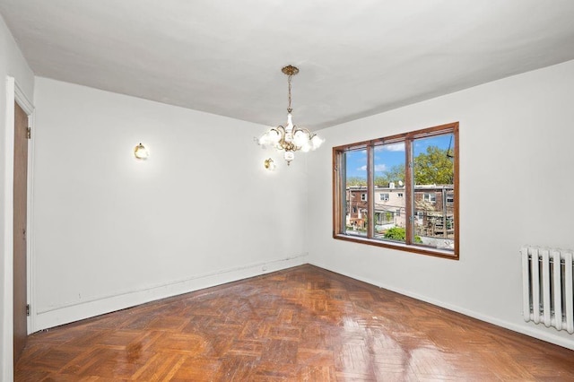 283 Bay 14th St, Brooklyn, NY 11214 - unfurnished room with a chandelier and radiator heating unit