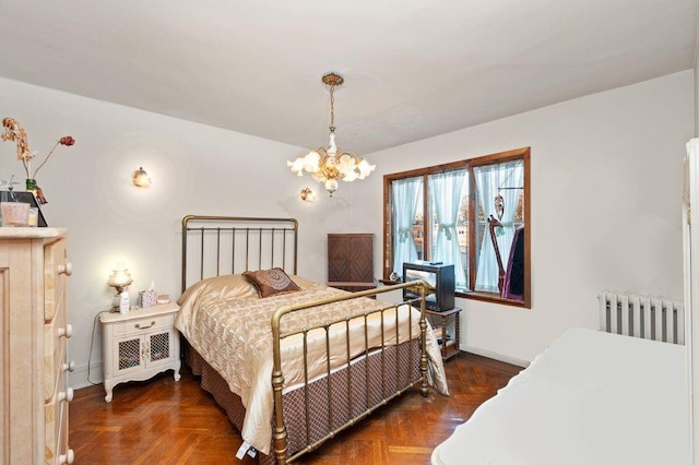 bedroom featuring radiator, dark parquet flooring, and a notable chandelier