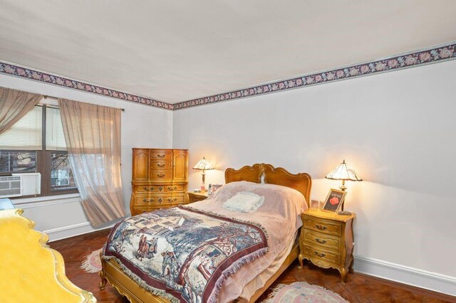 bedroom featuring cooling unit and dark parquet floors