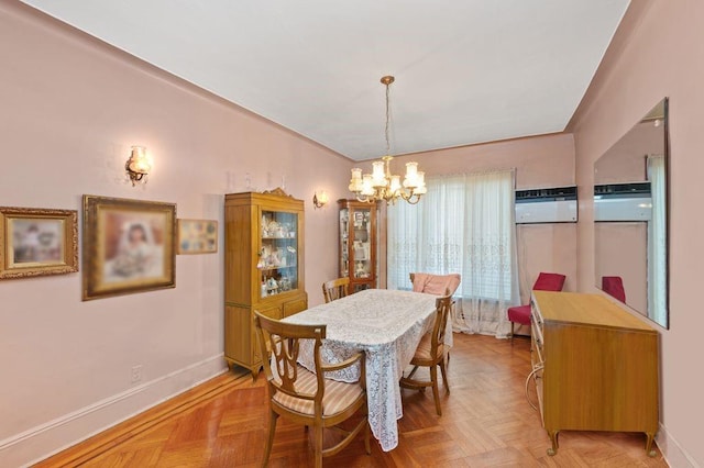 dining area featuring light parquet flooring and a notable chandelier