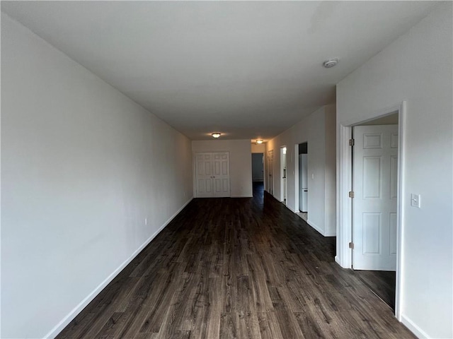 hall with dark hardwood / wood-style flooring