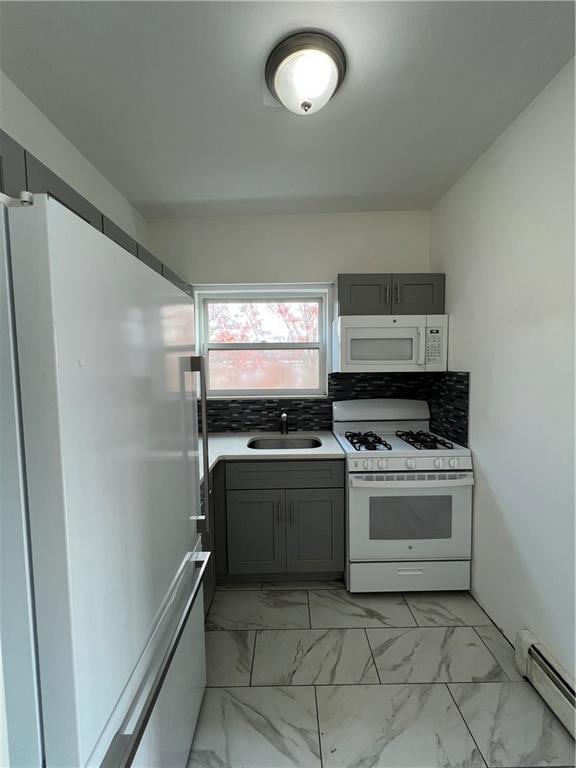 kitchen with sink, white appliances, gray cabinetry, tasteful backsplash, and a baseboard radiator