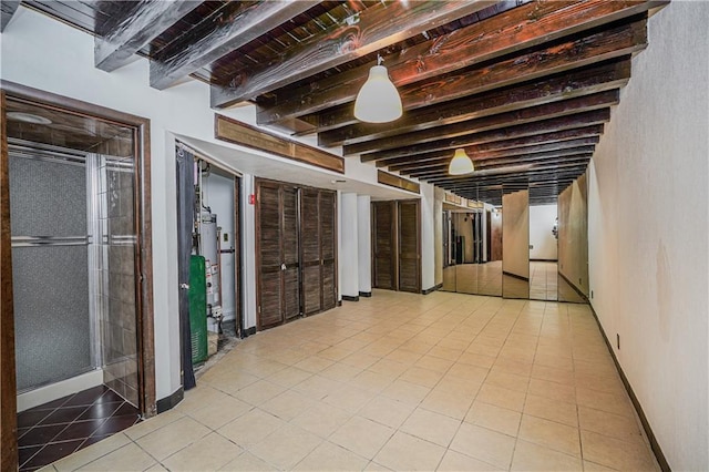 below grade area with tile patterned floors and baseboards