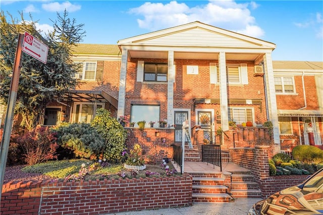 view of front of house featuring brick siding