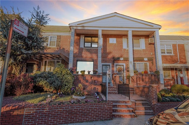 view of front of property featuring brick siding