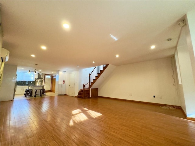 interior space with wood-type flooring and sink