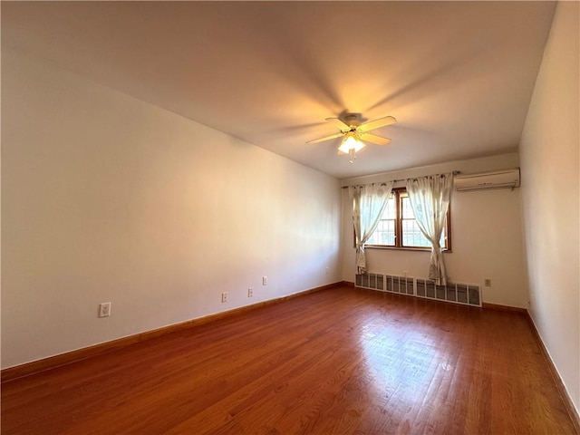 empty room featuring dark hardwood / wood-style flooring, radiator heating unit, ceiling fan, and a wall unit AC