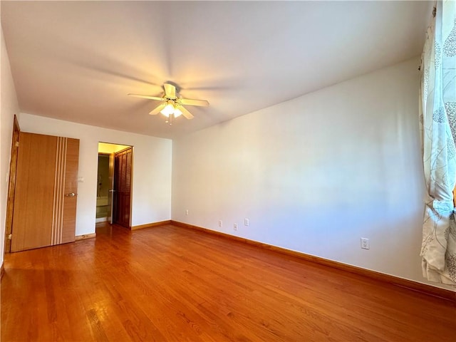 unfurnished room featuring hardwood / wood-style flooring and ceiling fan