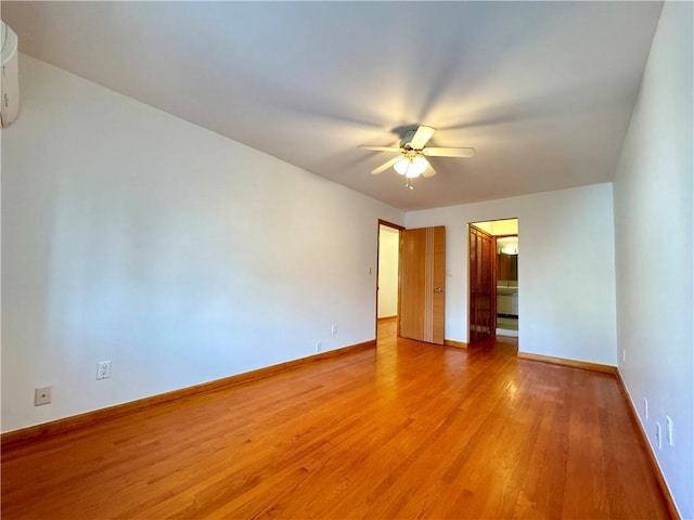 unfurnished room featuring light hardwood / wood-style floors and ceiling fan