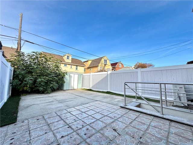 view of patio / terrace with a storage unit