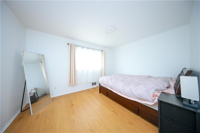 bedroom with light hardwood / wood-style flooring