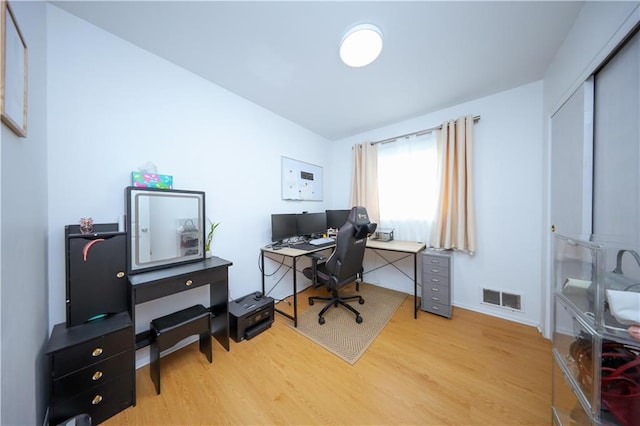 home office featuring light hardwood / wood-style flooring