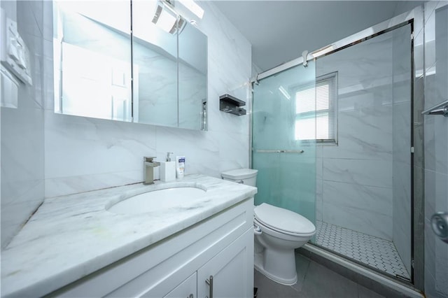 bathroom with vanity, backsplash, toilet, walk in shower, and tile walls