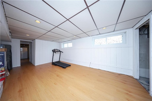 workout area with hardwood / wood-style floors