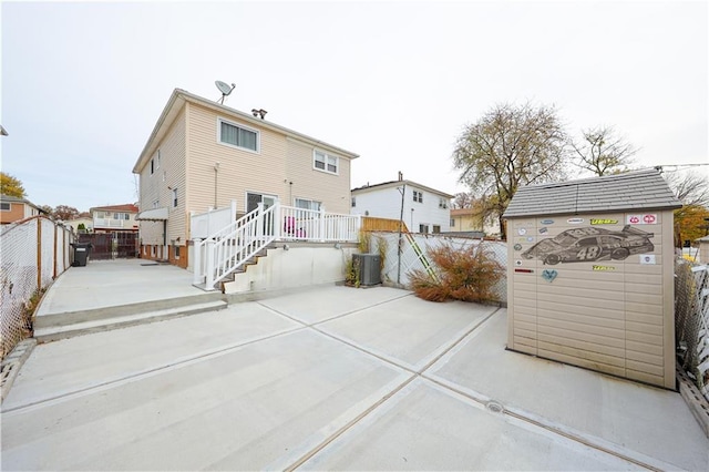 back of property featuring central AC unit