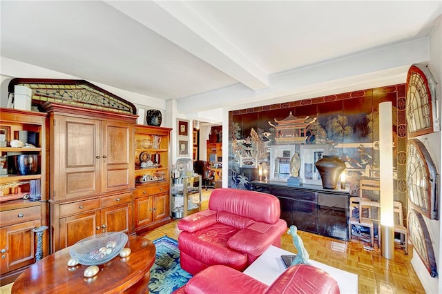 living room featuring beam ceiling and light parquet floors