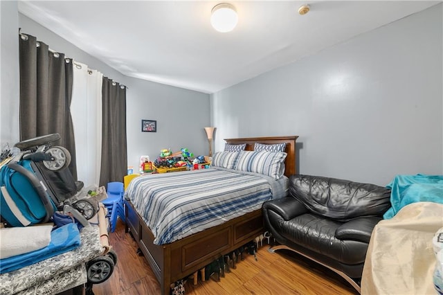 bedroom with hardwood / wood-style flooring