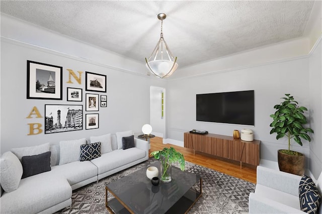 living room with wood-type flooring and a textured ceiling