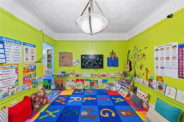 rec room featuring a textured ceiling