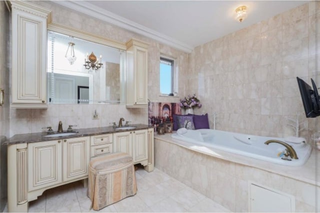 bathroom featuring tiled tub, vanity, tile walls, and crown molding