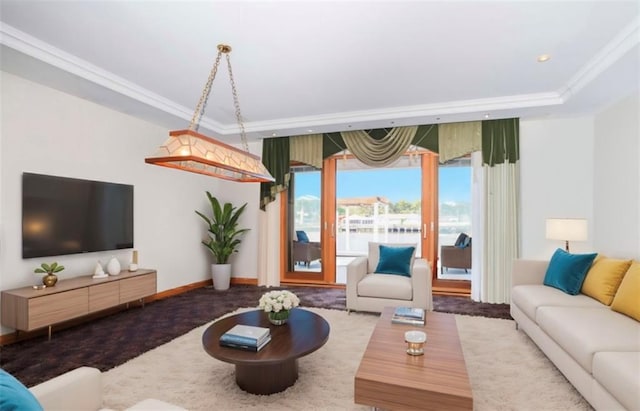 living room with ornamental molding and a water view