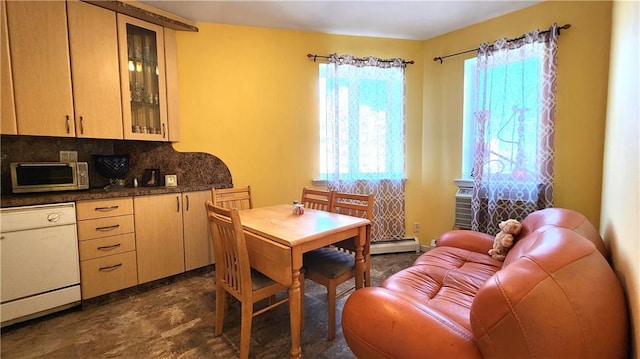 interior space with dishwasher, light brown cabinets, baseboard heating, and backsplash