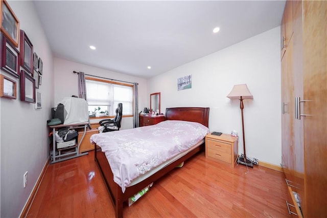 bedroom with light hardwood / wood-style flooring