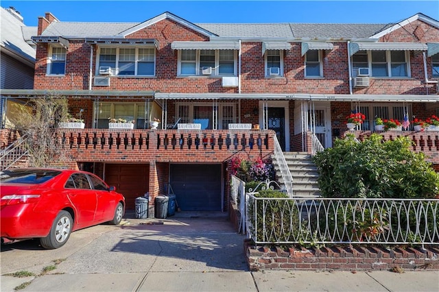 townhome / multi-family property featuring a garage