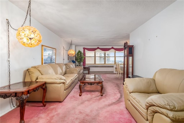 living room featuring carpet floors, radiator, and a textured ceiling